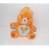 Ursinho Carinhoso Sentado 2 Flores Barriga 17 Cm Altura